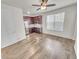 Charming kitchen features updated cabinetry, stainless appliances, and hardwood-style floors at 14880 Chicago St, Parker, CO 80134