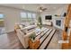 Bright living room featuring neutral furniture, fireplace, and large windows offering scenic views at 14880 Chicago St, Parker, CO 80134