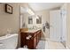 This well-maintained bathroom is equipped with double vanity and nice tiling at 430 Zang St # 4-103, Lakewood, CO 80228
