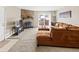 Comfortable living room featuring a stone fireplace and sliding door access to a patio at 430 Zang St # 4-103, Lakewood, CO 80228