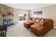 Comfortable living room featuring a stone fireplace and sliding door access to a patio at 430 Zang St # 4-103, Lakewood, CO 80228