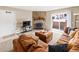 Comfortable living room featuring a stone fireplace and sliding door access to a patio at 430 Zang St # 4-103, Lakewood, CO 80228