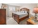 Spacious main bedroom features a large window and traditional furniture for a comfortable retreat at 430 Zang St # 4-103, Lakewood, CO 80228