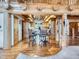 Open-concept kitchen with a breakfast bar, wood beams, and seamless flow to the living area is great for gatherings at 7076 Boreas Rd, Larkspur, CO 80118