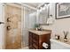 Bathroom with glass-enclosed shower, vanity with granite countertop, and modern fixtures at 320 S Ames St # 8, Lakewood, CO 80226