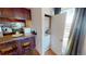 Cozy kitchen featuring a breakfast bar and in-unit washer and dryer at 320 S Ames St # 8, Lakewood, CO 80226