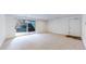 Spacious basement with sliding door and natural light, perfect for entertaining and relaxation at 4966 Delaware Dr, Larkspur, CO 80118
