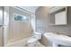 Well-lit bathroom with a window, featuring a classic tub and a modern sink for a functional space at 4966 Delaware Dr, Larkspur, CO 80118