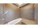 Luxurious bathroom featuring a sunken tub, unique tilework and a relaxing and stylish space at 4966 Delaware Dr, Larkspur, CO 80118