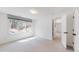Cozy bedroom with large windows offering scenic views and filled with natural light at 4966 Delaware Dr, Larkspur, CO 80118