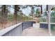 Enjoy this home's deck overlooking the forest and providing the perfect setting for outdoor living at 4966 Delaware Dr, Larkspur, CO 80118