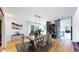 Elegant dining room featuring hardwood floors, stylish decor, and a view of the outdoors at 4966 Delaware Dr, Larkspur, CO 80118