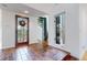 Entryway featuring tile flooring, decorative stained glass front door, and a spiral staircase at 4966 Delaware Dr, Larkspur, CO 80118