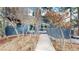 Charming walkway leading to the house, surrounded by natural beauty and wooden accents at 4966 Delaware Dr, Larkspur, CO 80118