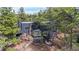 Modern exterior of a home featuring a deck, greenhouse windows, and natural wood walkways at 4966 Delaware Dr, Larkspur, CO 80118