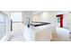 Bright hallway showcasing modern railing, offering an airy and inviting transition between spaces at 4966 Delaware Dr, Larkspur, CO 80118