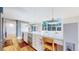 Spacious kitchen features modern appliances, a skylight and a large island with bar stool seating at 4966 Delaware Dr, Larkspur, CO 80118