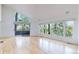 Bright open room with vaulted ceilings, hardwood floors and large windows with outdoor views at 4966 Delaware Dr, Larkspur, CO 80118
