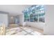 Bright living area featuring a glass ceiling with beautiful outdoor views and hardwood floors at 4966 Delaware Dr, Larkspur, CO 80118