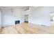 Open living room with hardwood floors, high ceilings and fireplace at 4966 Delaware Dr, Larkspur, CO 80118