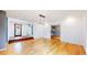 Open living room area with hardwood floors and decorative front door at 4966 Delaware Dr, Larkspur, CO 80118
