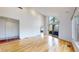 Spacious room featuring hardwood floors, high ceilings, and large windows with lots of natural light at 4966 Delaware Dr, Larkspur, CO 80118
