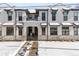 Three-unit building exterior with stone and stucco at 1636 Winona Ct, Denver, CO 80204