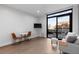 Room featuring a small dining area and a door leading out onto a private balcony with great views at 1901 Wazee St # 312, Denver, CO 80202