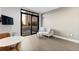 Bright living space with sliding glass door access to a balcony with seating and city views at 1901 Wazee St # 312, Denver, CO 80202