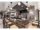 Upscale bar area featuring a marble countertop and modern pendant lighting at 1901 Wazee St # 312, Denver, CO 80202
