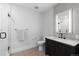 Modern bathroom with floating vanity, sleek fixtures, and tiled shower at 1901 Wazee St # 312, Denver, CO 80202