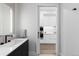 Bathroom with modern finishes and view into kitchen at 1901 Wazee St # 312, Denver, CO 80202