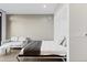 This well-lit bedroom features a Murphy bed and additional sofa seating at 1901 Wazee St # 312, Denver, CO 80202