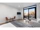 Bright bedroom featuring a walk-out balcony with furniture and exterior views at 1901 Wazee St # 312, Denver, CO 80202