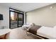Cozy, bright room includes a murphy bed, small sitting area, and access to a balcony with patio furniture at 1901 Wazee St # 312, Denver, CO 80202
