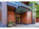 Welcoming entrance to 1901 Wazee Street featuring modern architecture, wood accents, and inviting landscaping at 1901 Wazee St # 312, Denver, CO 80202