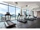 Modern gym featuring treadmills with large windows overlooking the cityscape at 1901 Wazee St # 312, Denver, CO 80202