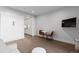 Comfortable living area featuring hardwood floors and a mounted flatscreen TV at 1901 Wazee St # 312, Denver, CO 80202