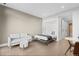 Comfortable living room with a sofa, ottoman, and murphy bed for flexible living at 1901 Wazee St # 312, Denver, CO 80202
