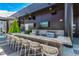 Rooftop outdoor kitchen featuring a bar, grill, and TV, ideal for entertaining guests at 1901 Wazee St # 312, Denver, CO 80202
