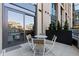Private patio with a table and seating for entertaining or relaxing at 1901 Wazee St # 312, Denver, CO 80202