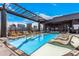 Rooftop pool featuring lounge chairs and a covered lounge area with cityscape views at 1901 Wazee St # 312, Denver, CO 80202