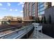 Rooftop deck with city views featuring modern furniture and glass railings at 1901 Wazee St # 312, Denver, CO 80202