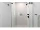 Modern shower with glass door and sleek matte black fixtures at 1901 Wazee St # 312, Denver, CO 80202