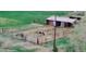 Aerial view of the pasture with cows and horse in their fenced enclosures at 16659 County Road 4, Brighton, CO 80603