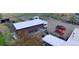 Aerial view shows the homes expansive lot with sheds and trailers at 16659 County Road 4, Brighton, CO 80603