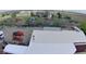 Aerial view shows the homes expansive lot with lots of machinery at 16659 County Road 4, Brighton, CO 80603