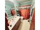 Bathroom featuring a large mirror, vanity, and shower with decorative curtain at 16659 County Road 4, Brighton, CO 80603