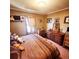 Cozy bedroom with a dresser, window, and decorative items, creating a relaxing atmosphere at 16659 County Road 4, Brighton, CO 80603