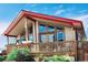 Charming home featuring a spacious front porch, complemented by large windows offering plenty of natural light at 16659 County Road 4, Brighton, CO 80603